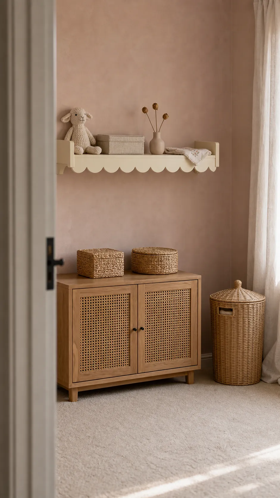 Cream scalloped nursery shelf styled with lightweight keepsakes