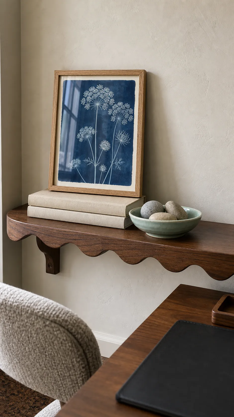 Scalloped shelf styled around a small framed cyanotype print