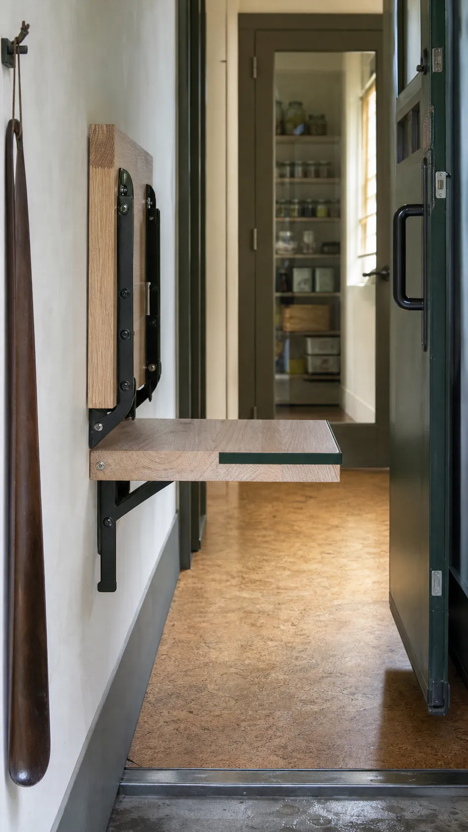 Wall-mounted flip-up seat in a tight garage entry