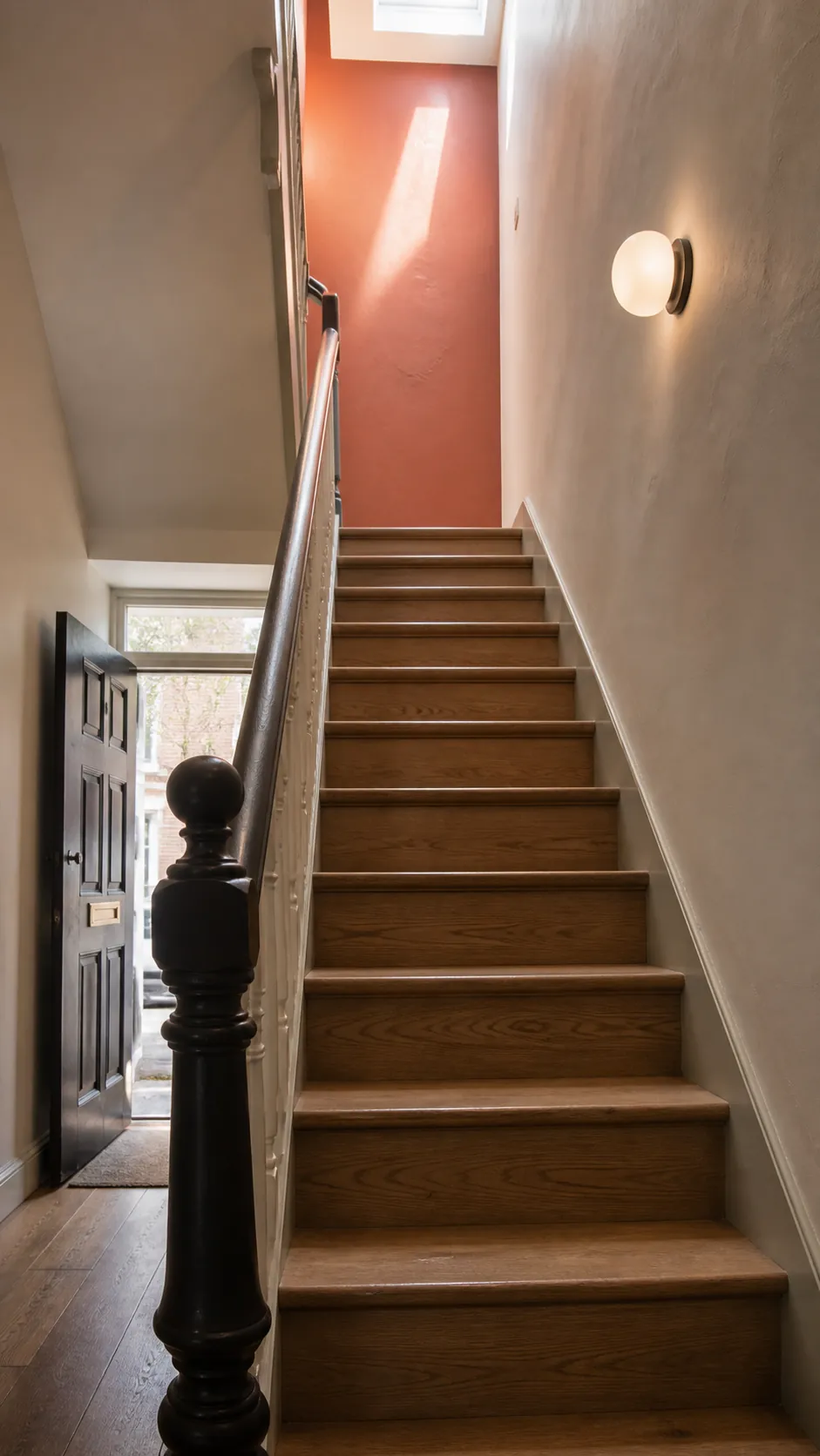 Small staircase drawing the eye to a bright upper landing