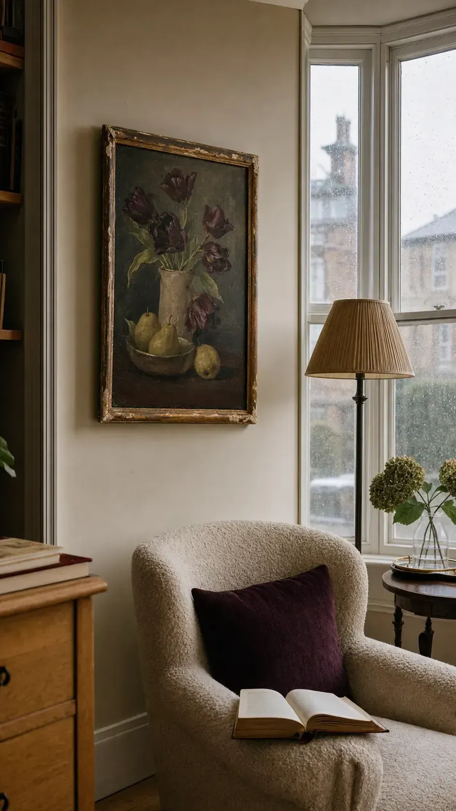 Thrifted floral still life painting adding character to a cozy reading nook