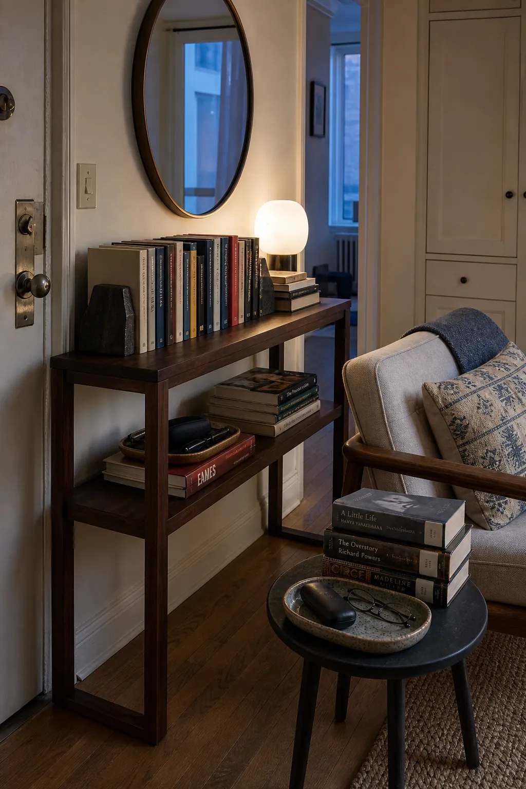 Curated small home library displayed on a slim console table