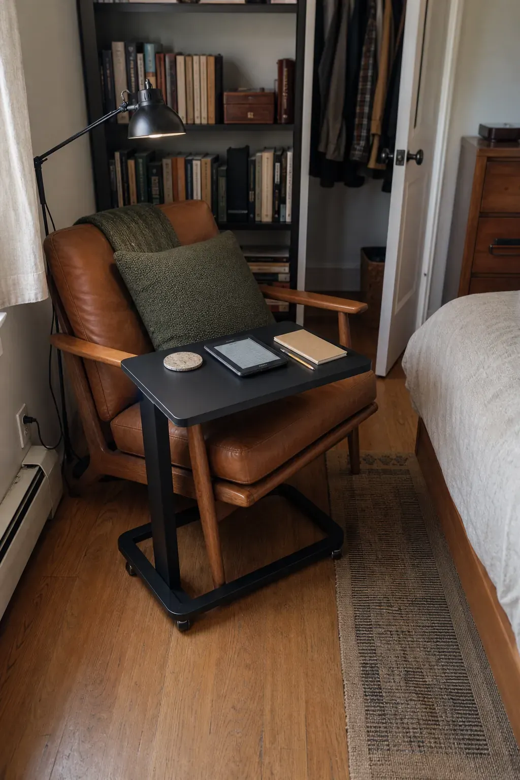 Space-saving C-table beside a compact bedroom reading chair