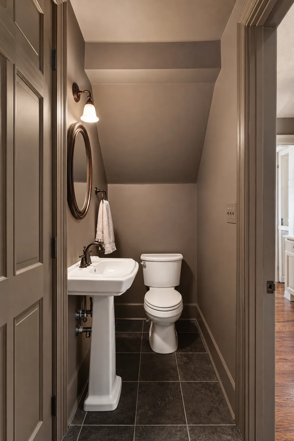 Walls and trim painted one calm color in a narrow half bath
