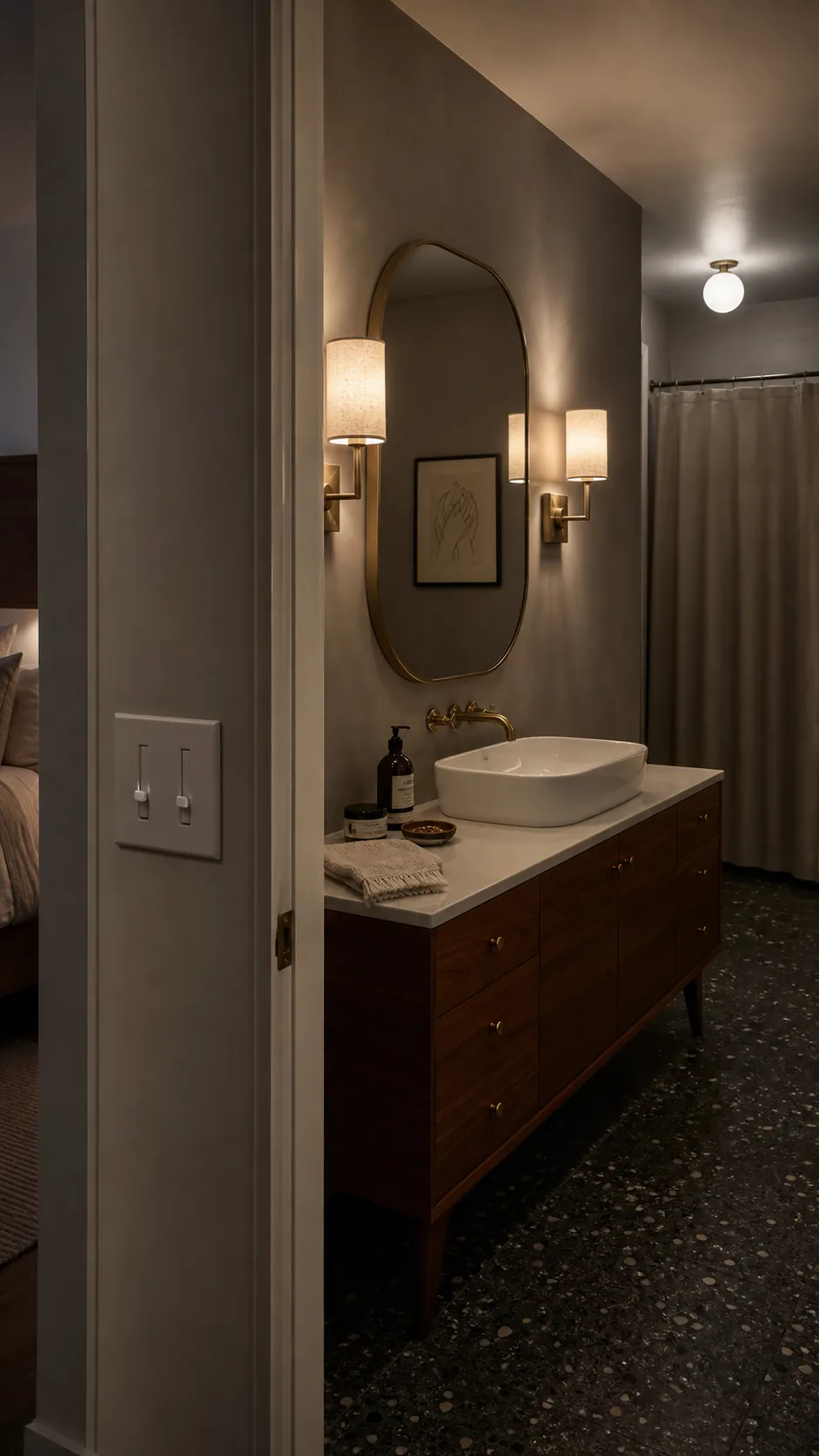 Layered bathroom mirror lighting shown at a soft dimmed evening level