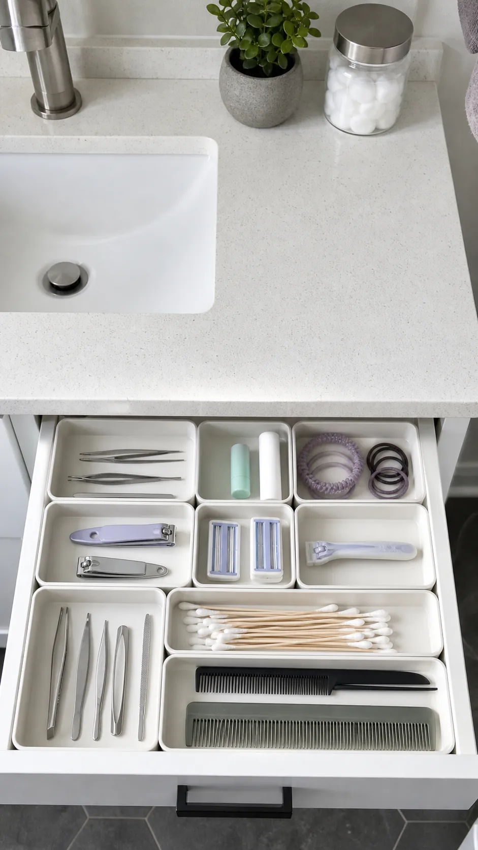 Shallow bathroom vanity drawer arranged with fitted modular trays