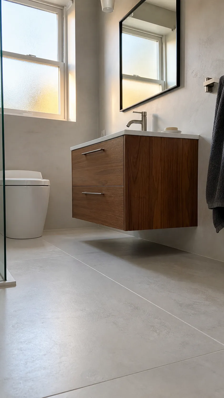 Wall-mounted vanity revealing floor space in a small bathroom