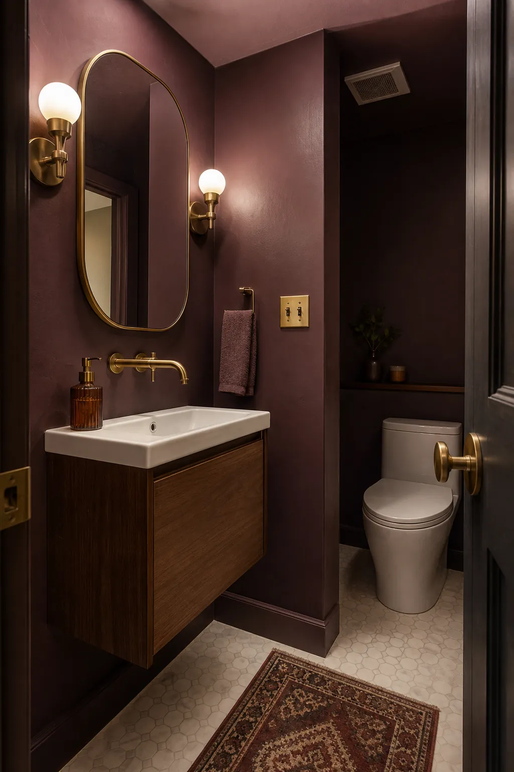 Color-drenched aubergine powder room with warm brass details