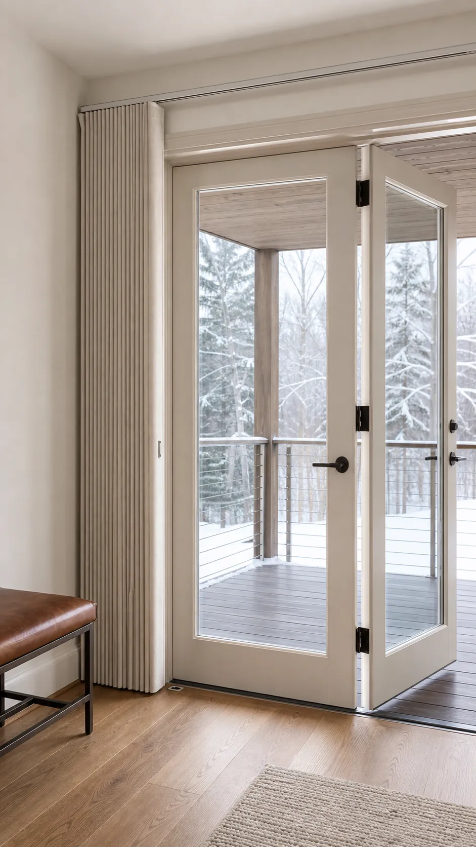 Slim vertical cellular shade stacked beside wide French doors