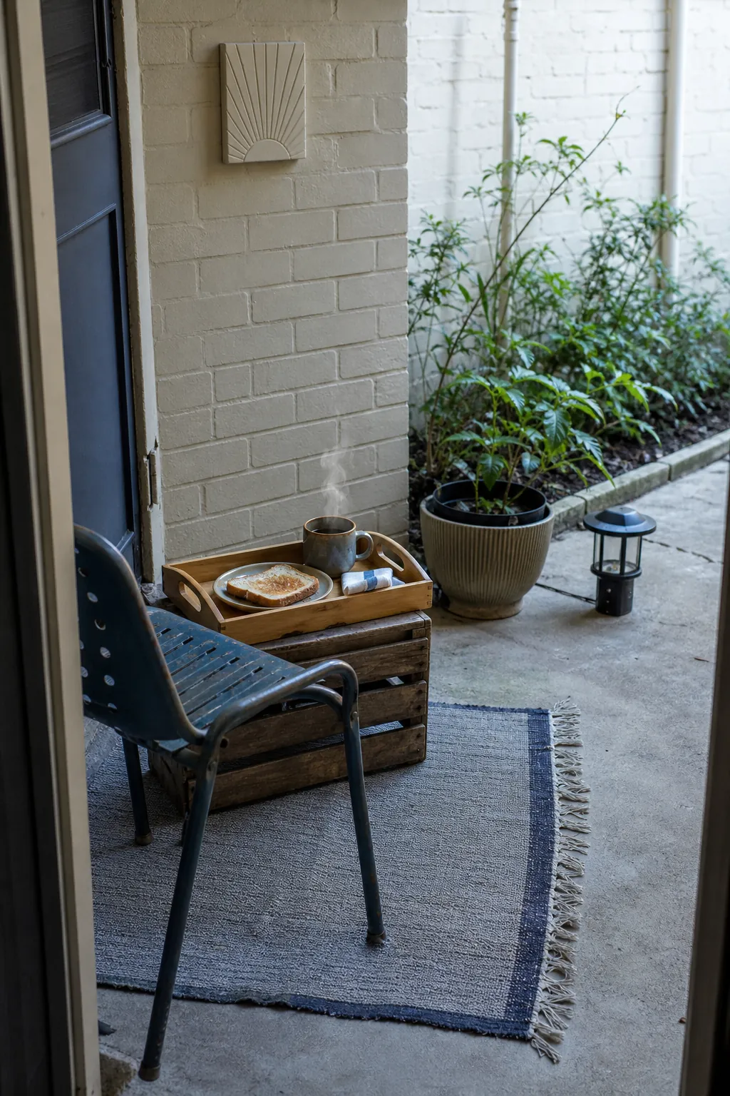 Simple finished budget patio centered on a useful coffee ritual