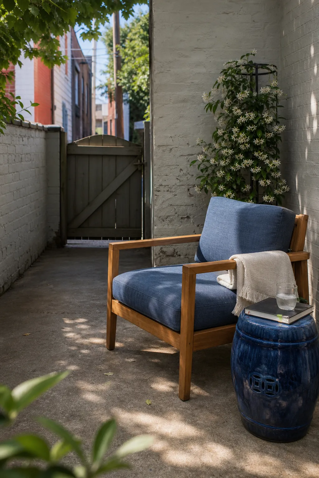 Quiet corner of a tiny patio with one comfortable reading chair