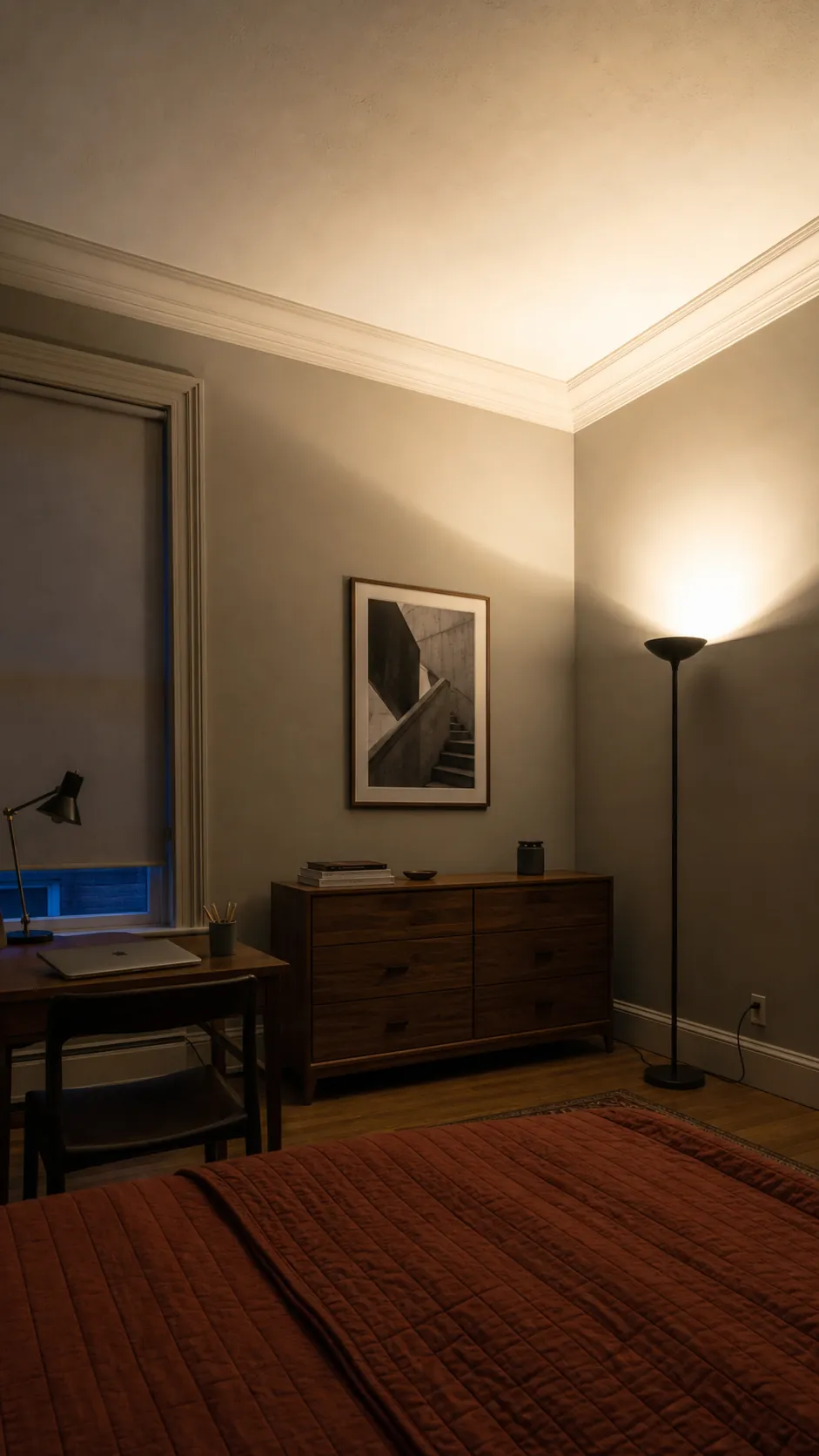 Corner uplight bouncing warm light across a bedroom ceiling