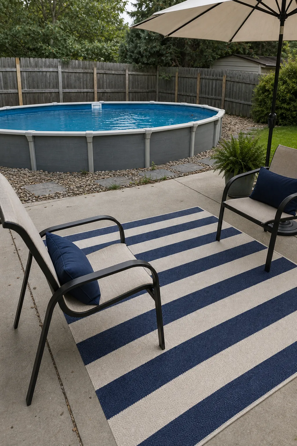 Outdoor rug defining a small poolside lounge zone