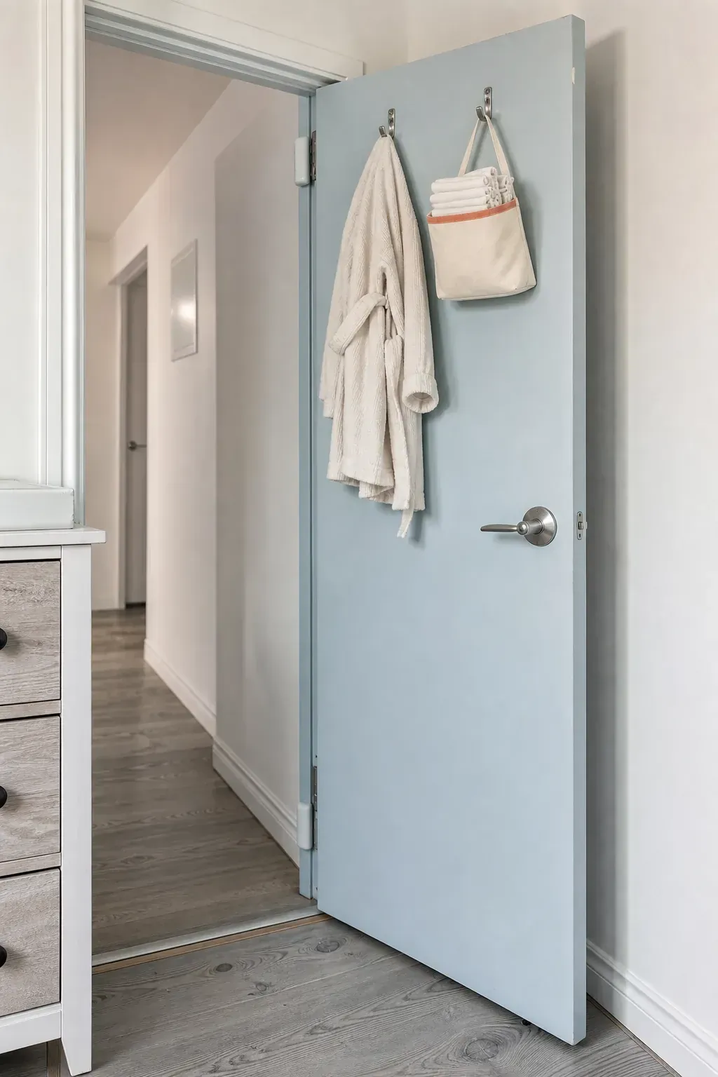 Minimal secure storage on the back of a nursery door