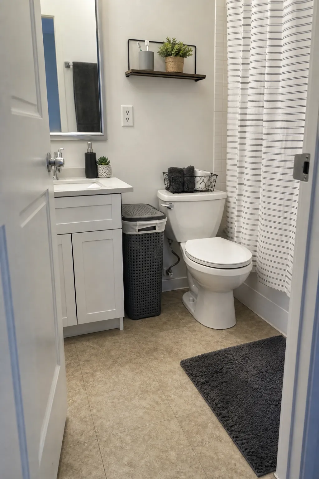 Slim ventilated hamper in a college apartment bathroom