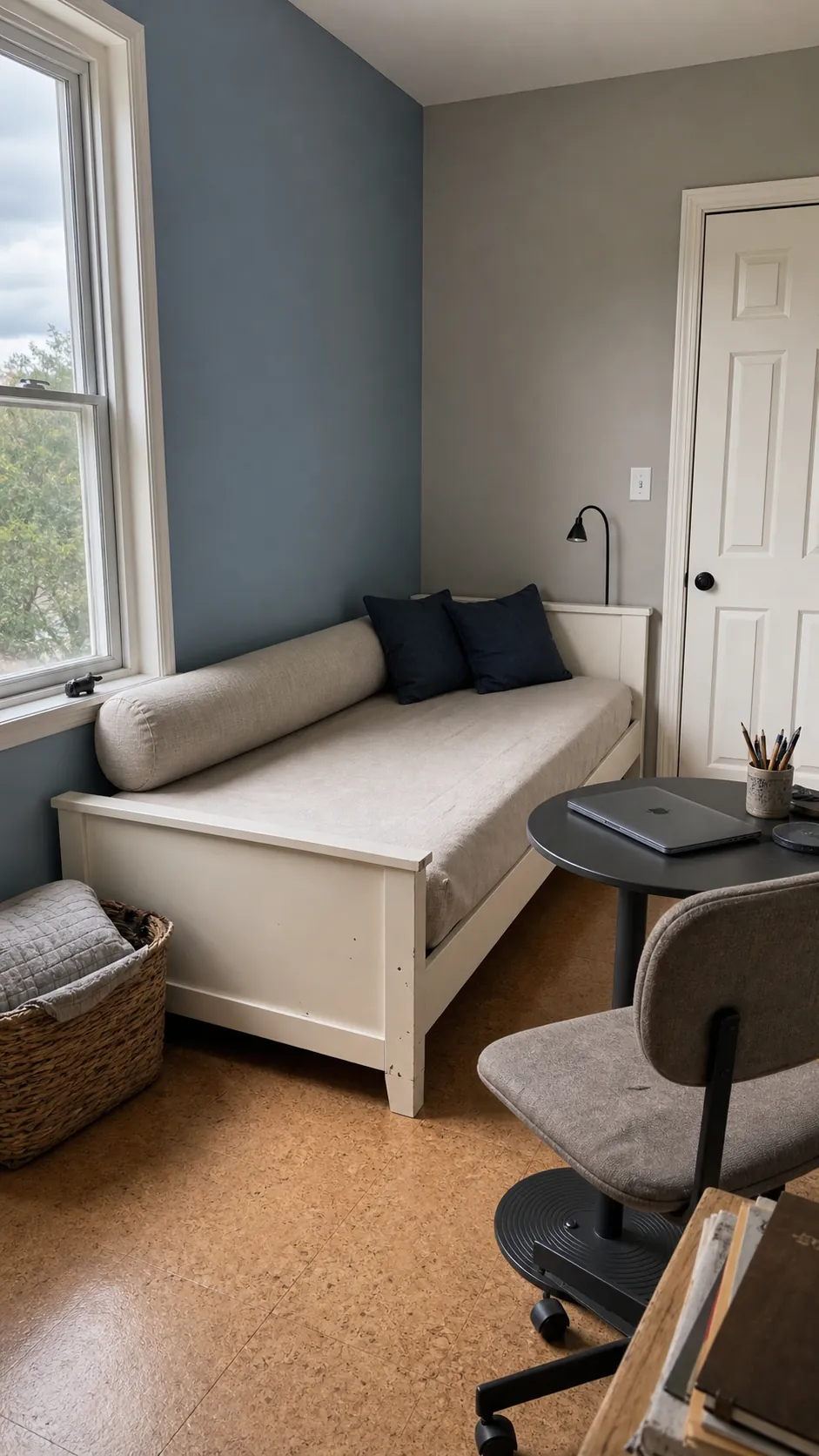 Corner twin bed styled as a daybed in a small multipurpose room