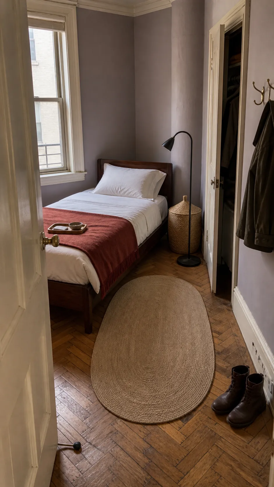 Angled twin bed solving an awkward small-room doorway