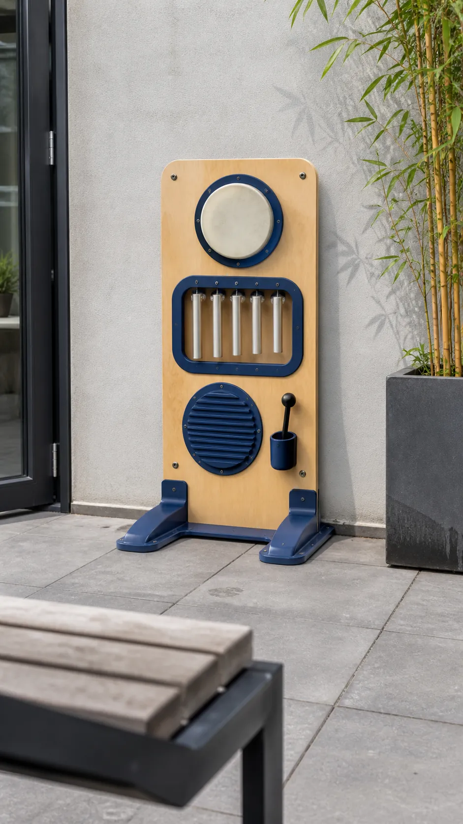 Child-safe outdoor music panel in a small patio play zone