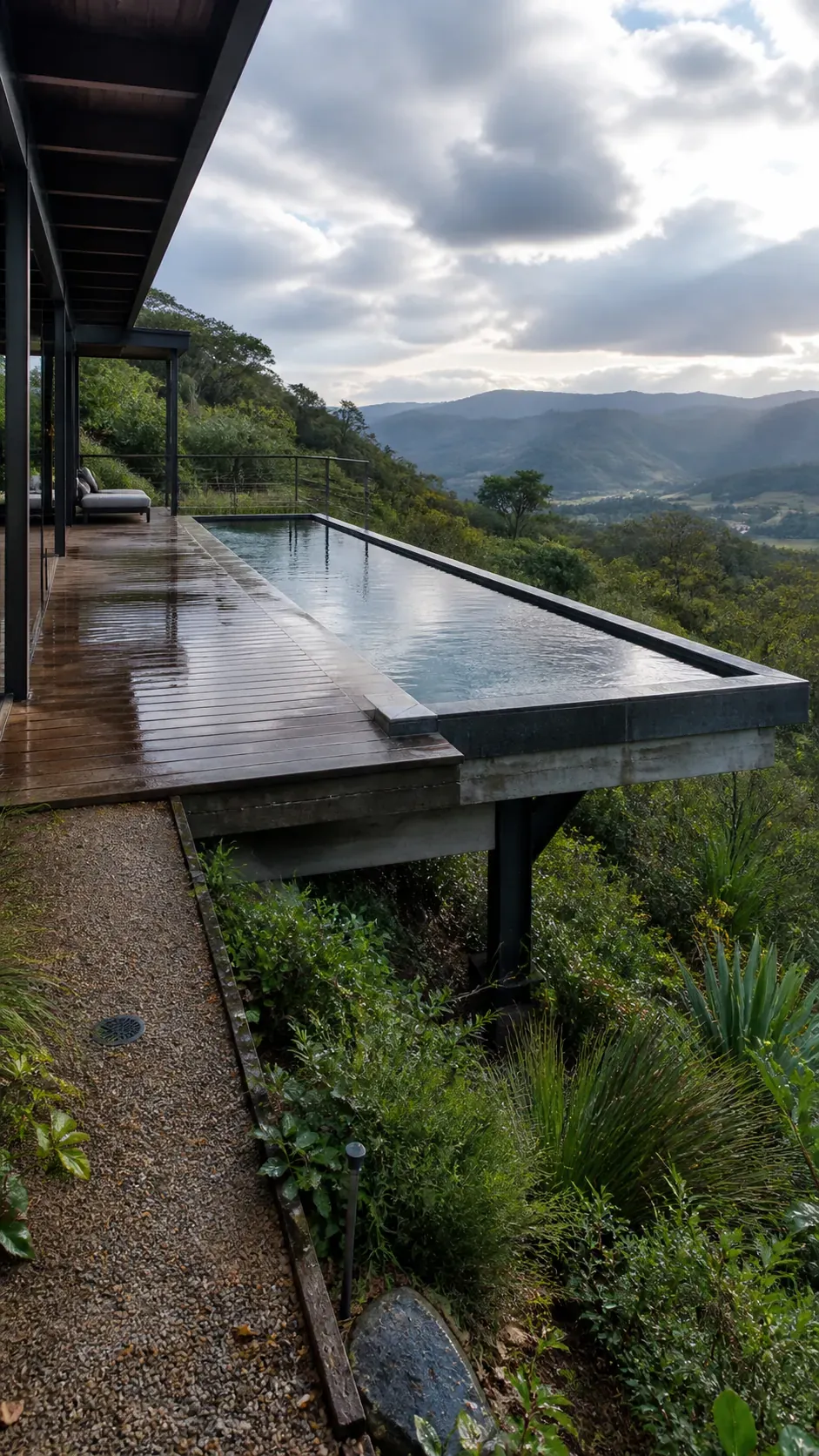 Modern pool with a cantilevered deck over a sloping backyard