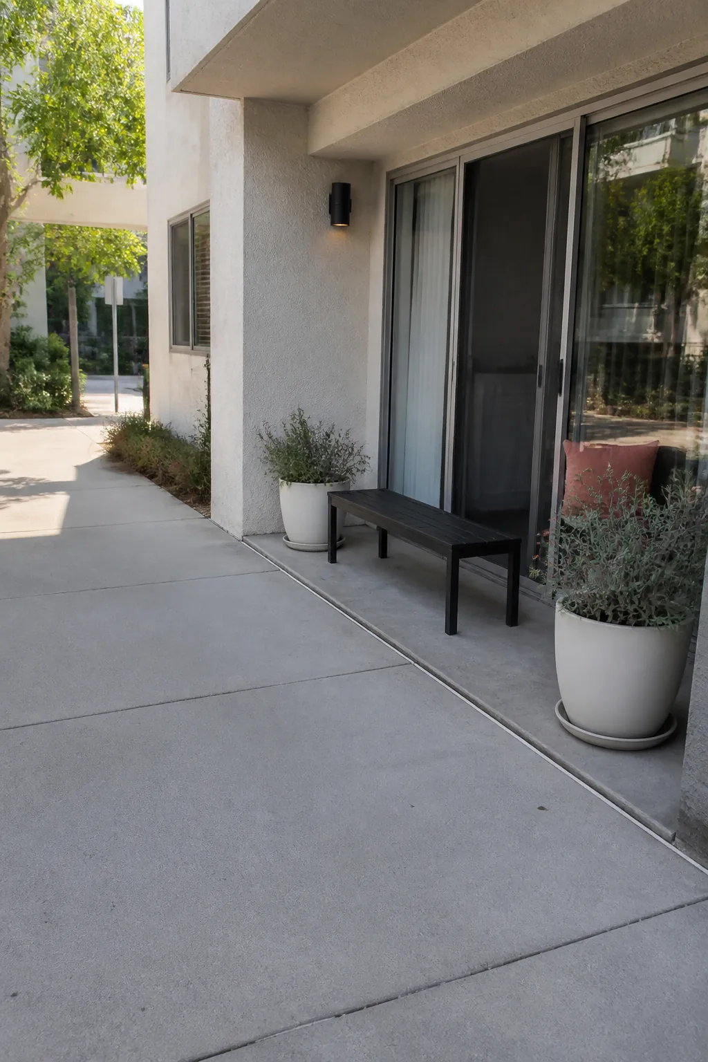 Low open buffer separating a patio from an apartment walkway