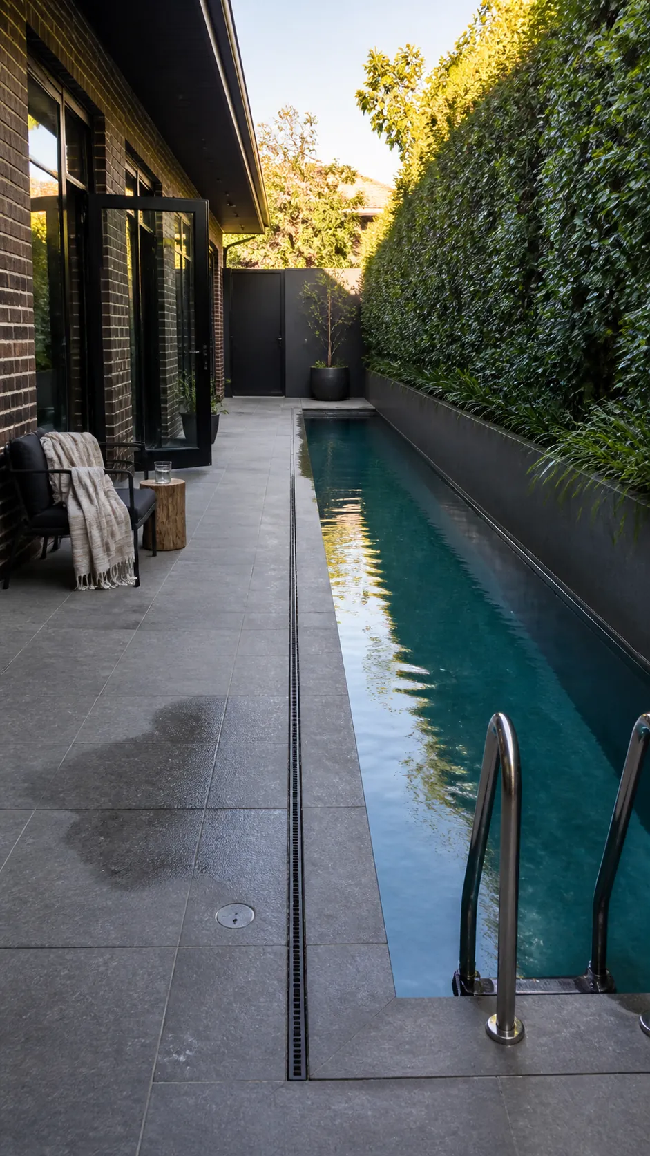 Narrow backyard pool running along the long property boundary