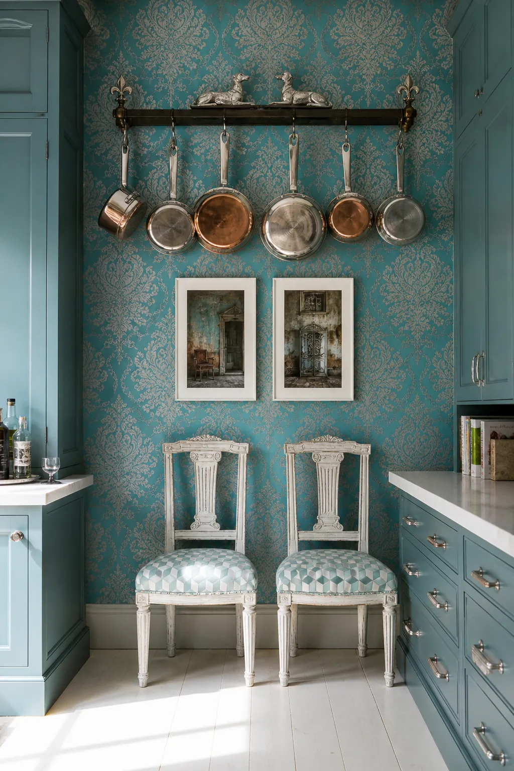 Turquoise patterned kitchen focal wall with a brass pot rail and paired framed prints