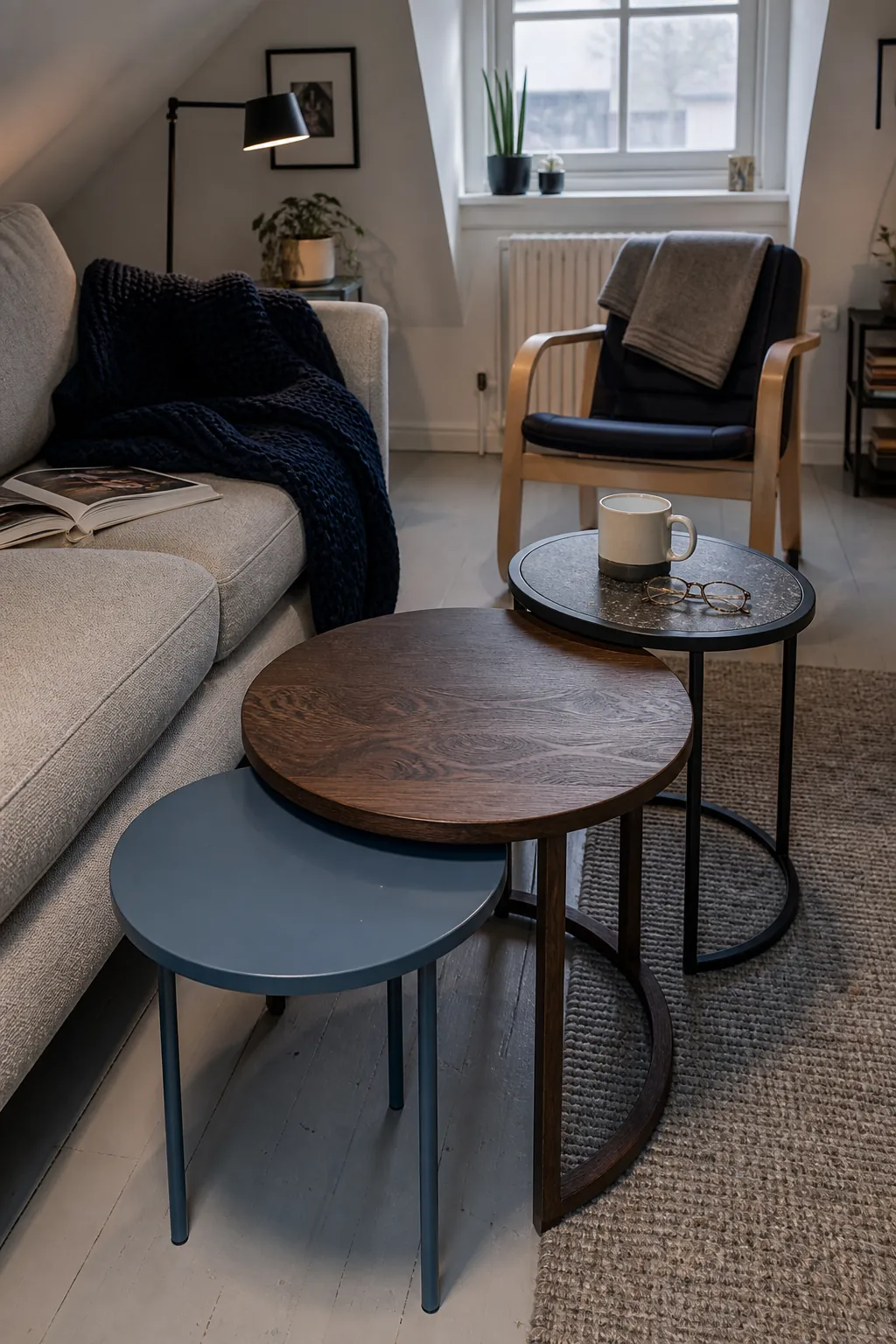 Nesting tables used as a flexible coffee table in a tiny living room