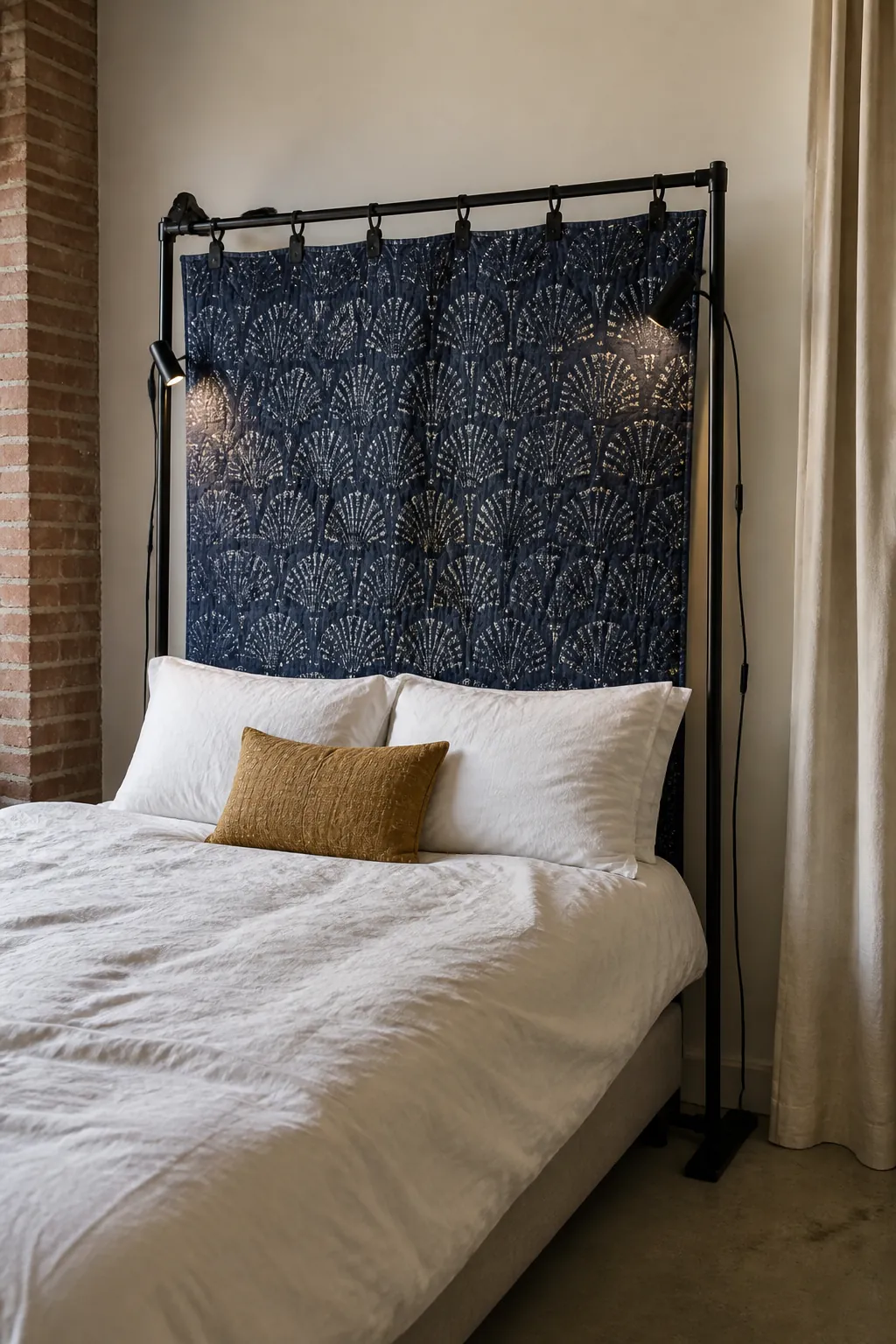 Renter-friendly removable fabric headboard in a mini studio apartment
