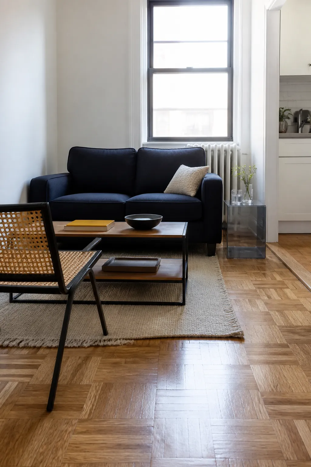 Open-base furniture preserving sightlines in a very small apartment