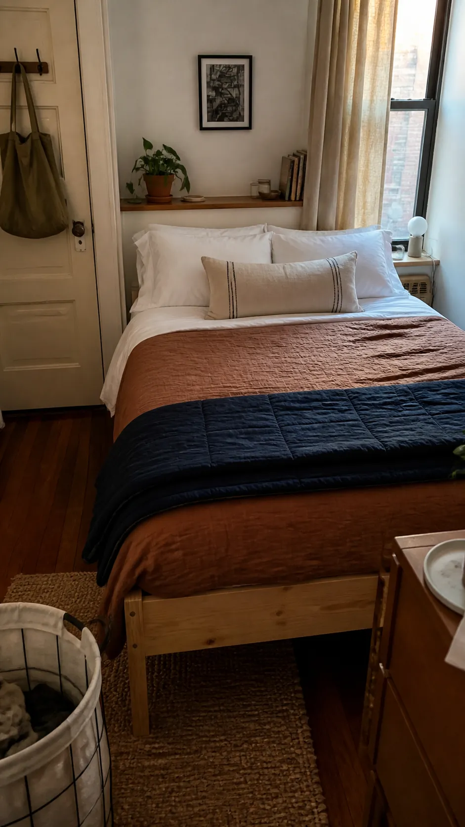upgrade the bed with layered basics in a small apartment on a budget