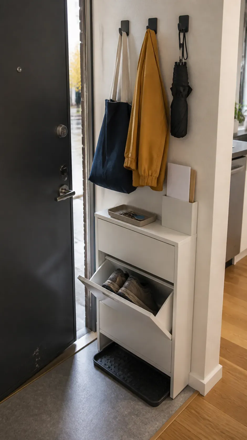 Compact renter friendly entry drop zone with shoe storage and hooks
