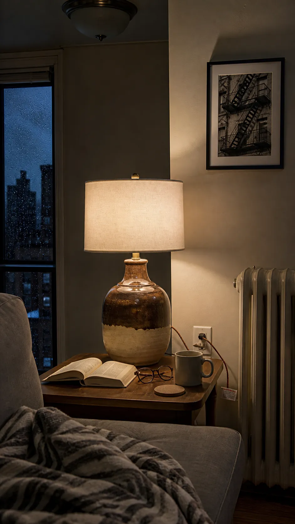 Thrifted ceramic lamp adding cozy light to a rental living room