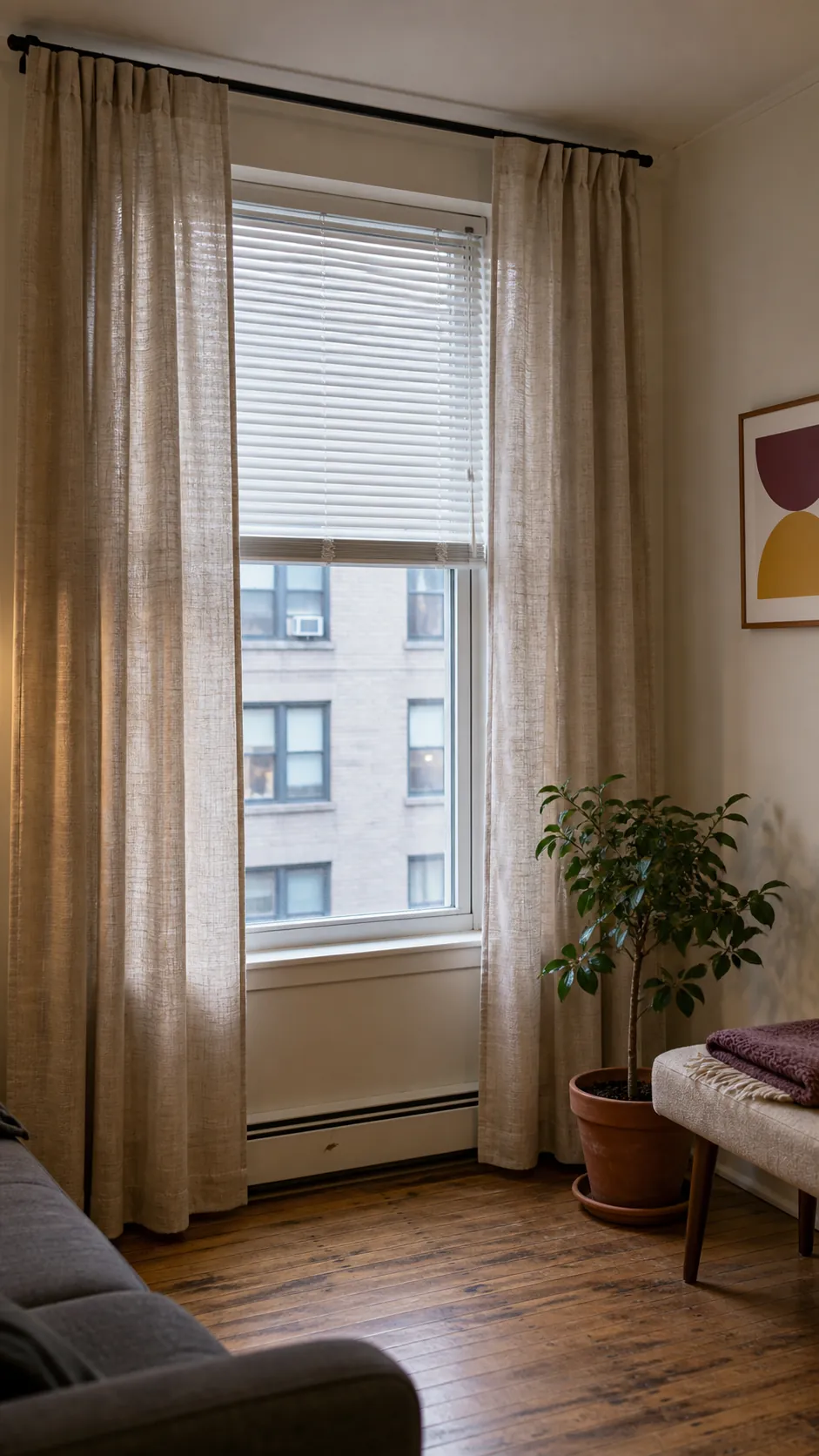 Full length curtains softening basic rental window blinds