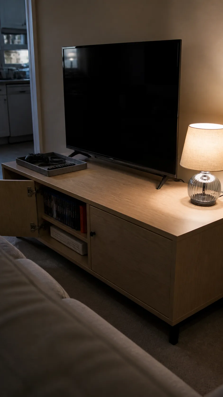 Small apartment media console styled with useful organized objects