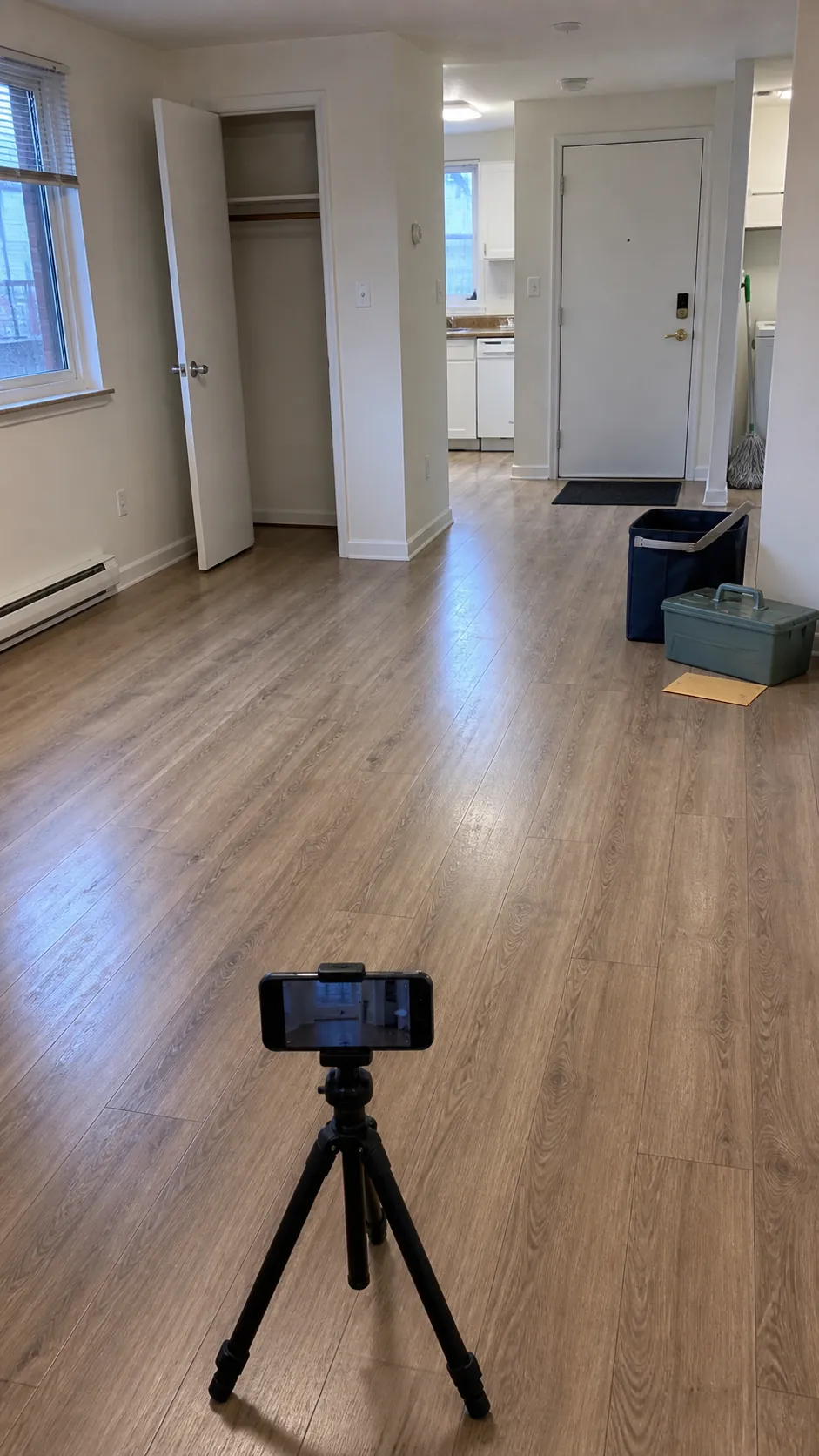 Clean empty apartment photographed after final move-out floor cleaning