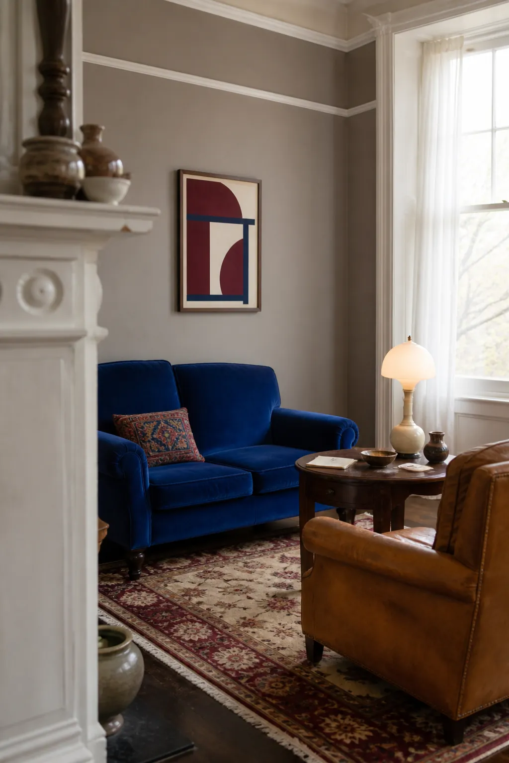 Mushroom taupe living room with colorful vintage seating and white trim