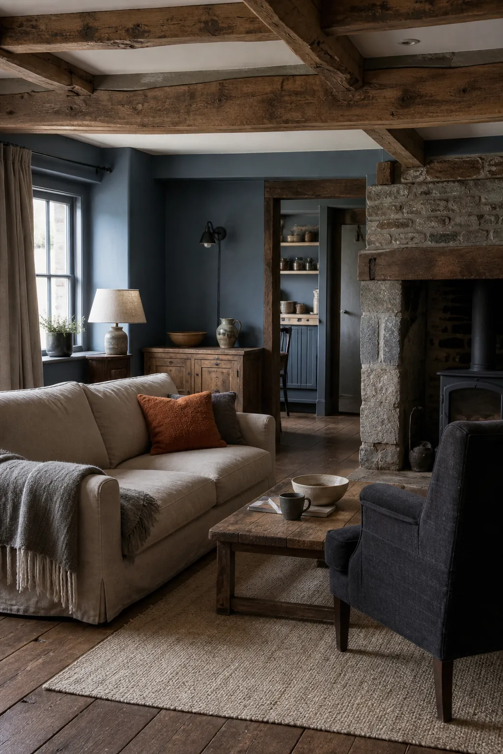Slate blue living room walls beneath rustic brown ceiling beams