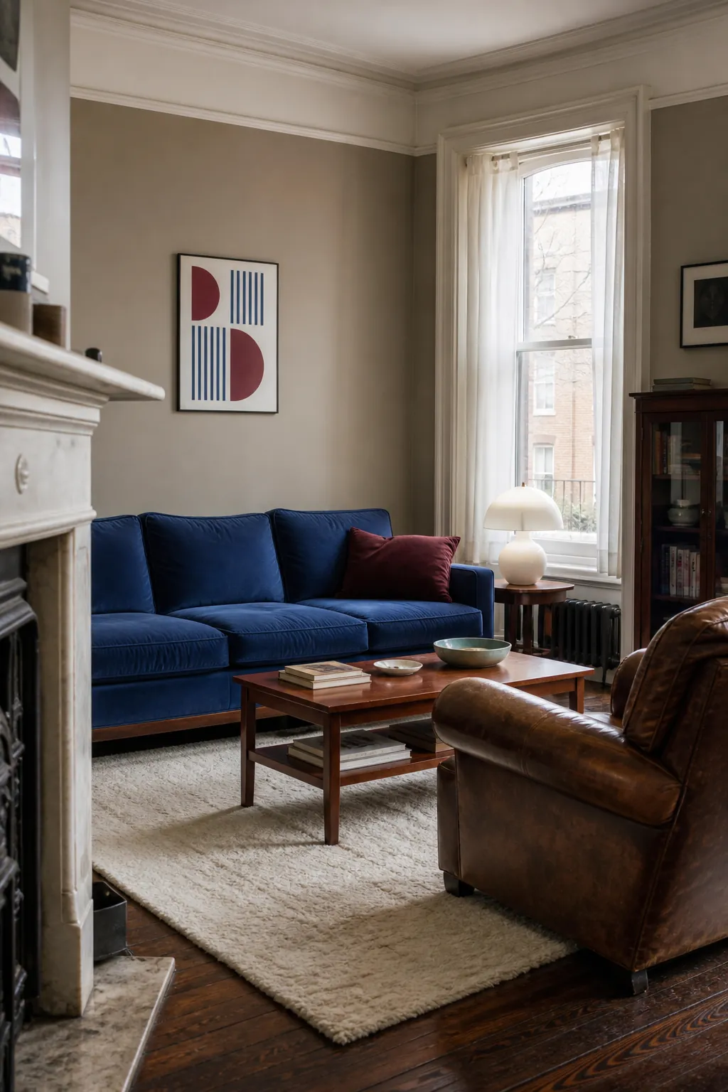 Mushroom taupe walls with dark wood and colorful traditional seating