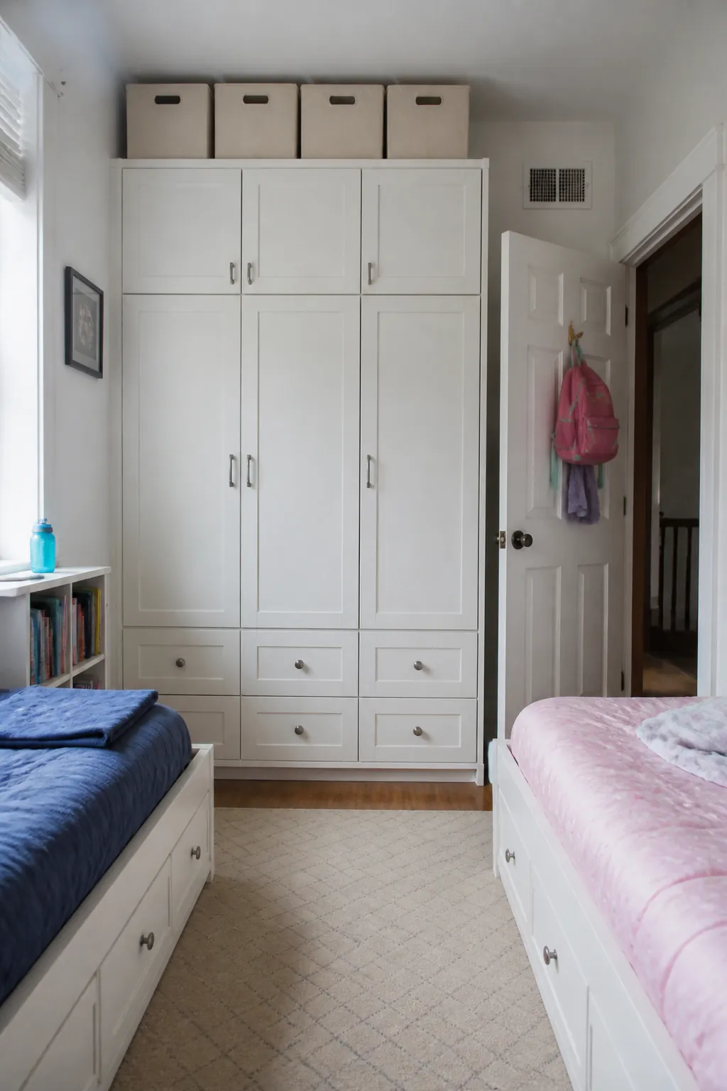 Store Off-Season Clothes Up High in a small shared children bedroom