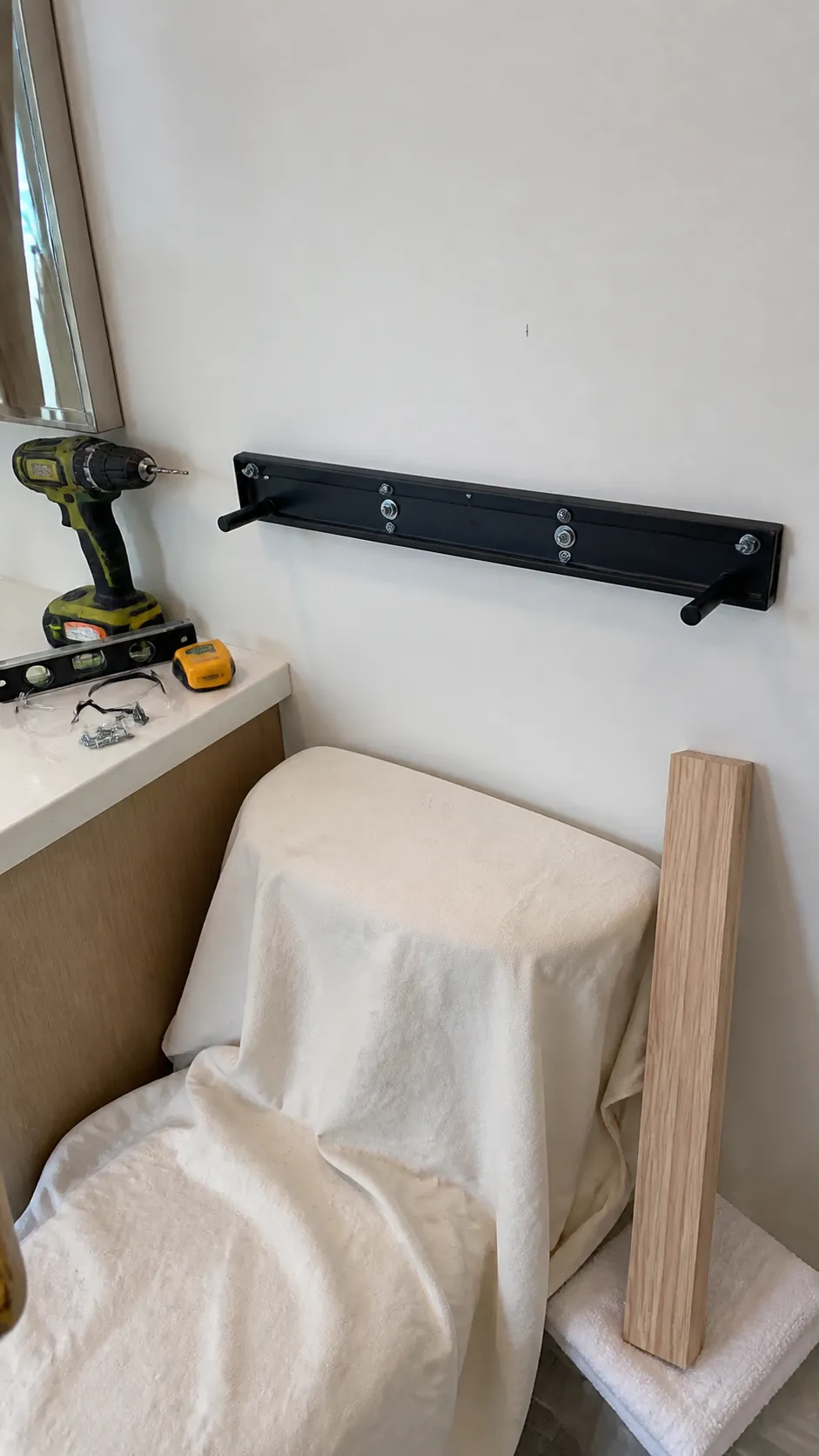 Secure stud-mounted brackets for a floating bathroom shelf