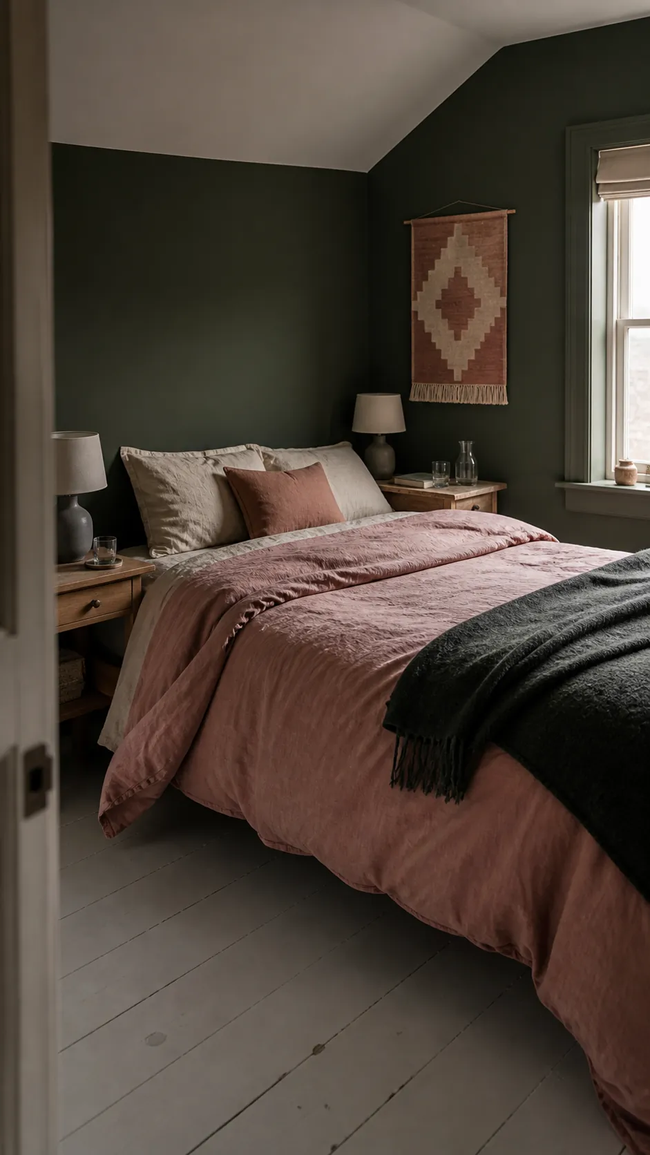 Dark green bedroom with dusty rose bedding and oatmeal linen layers