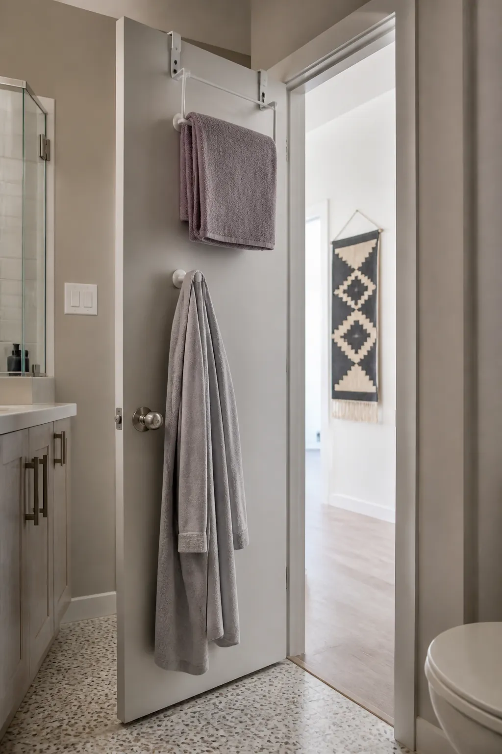 Over door towel storage checked for frame and floor clearance