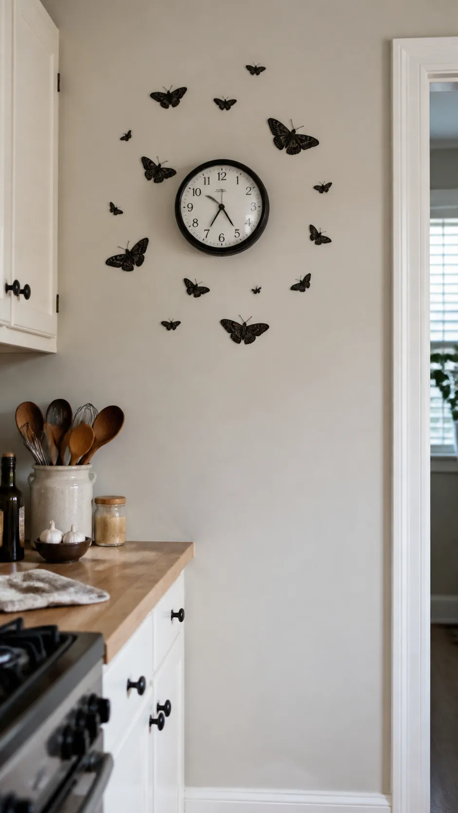 Moth decals arranged around a kitchen wall clock