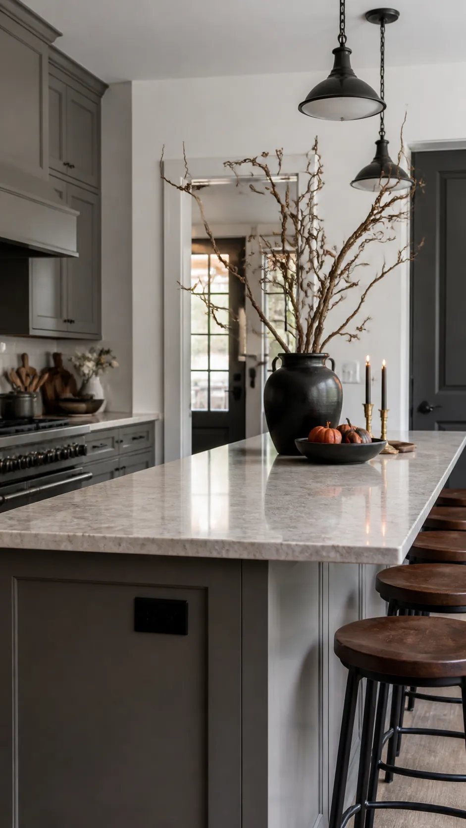Black vase with twisting branches on a Halloween kitchen island