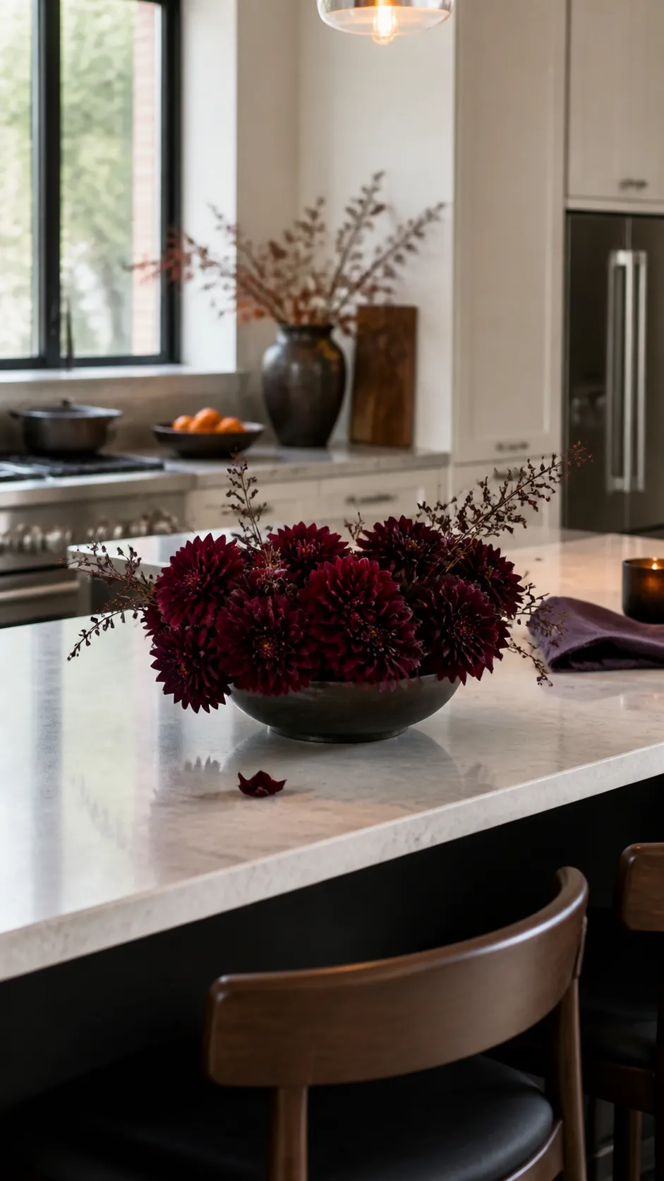 Burgundy dahlia centerpiece on a Halloween kitchen island