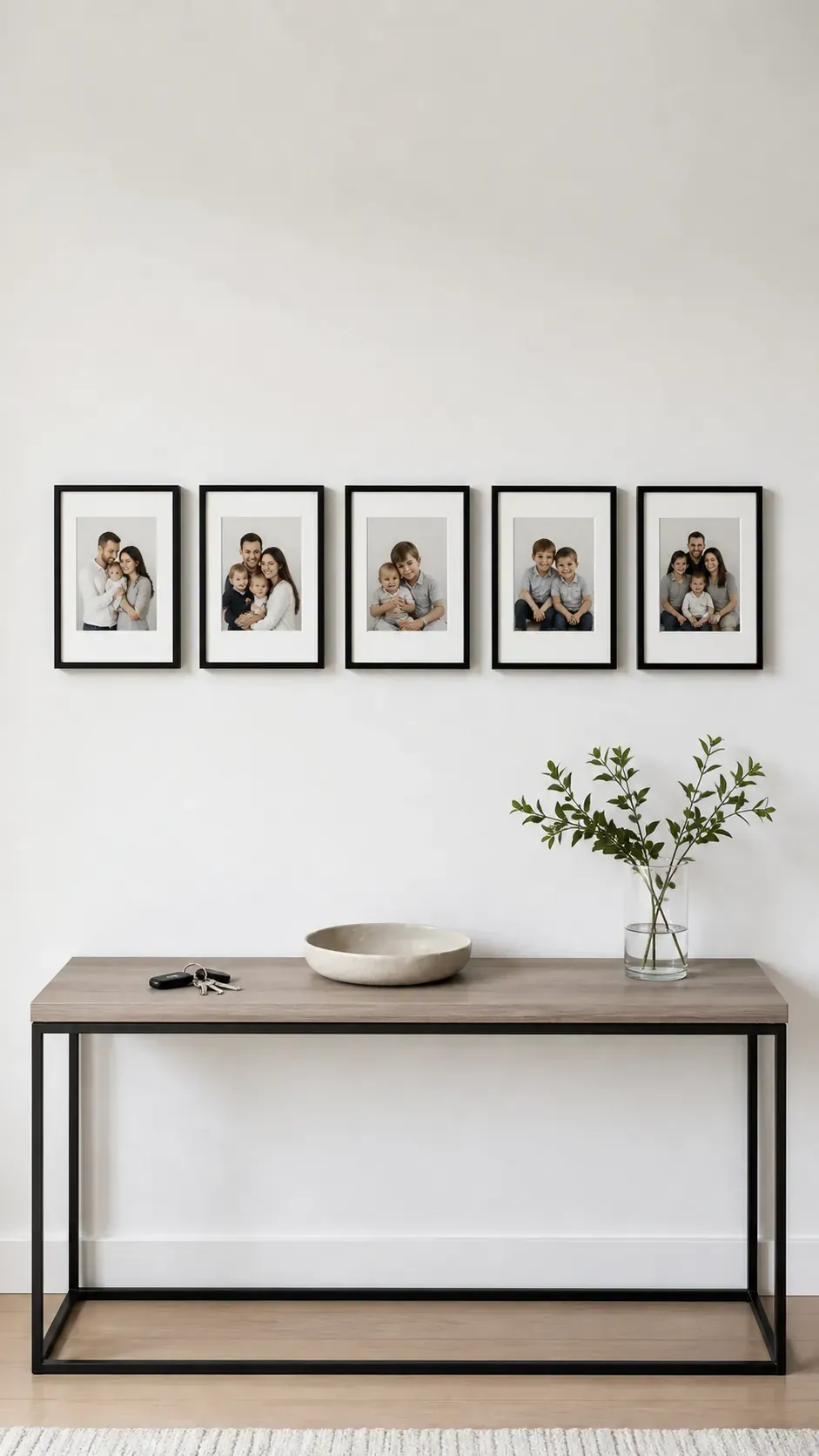 Minimal row of matching family photos above a console