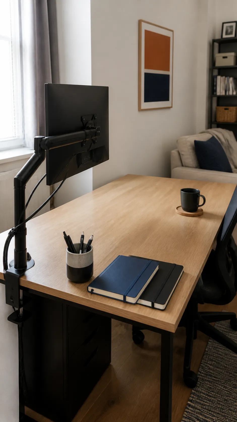 Compact desk with a monitor mounted on a slim clamp arm