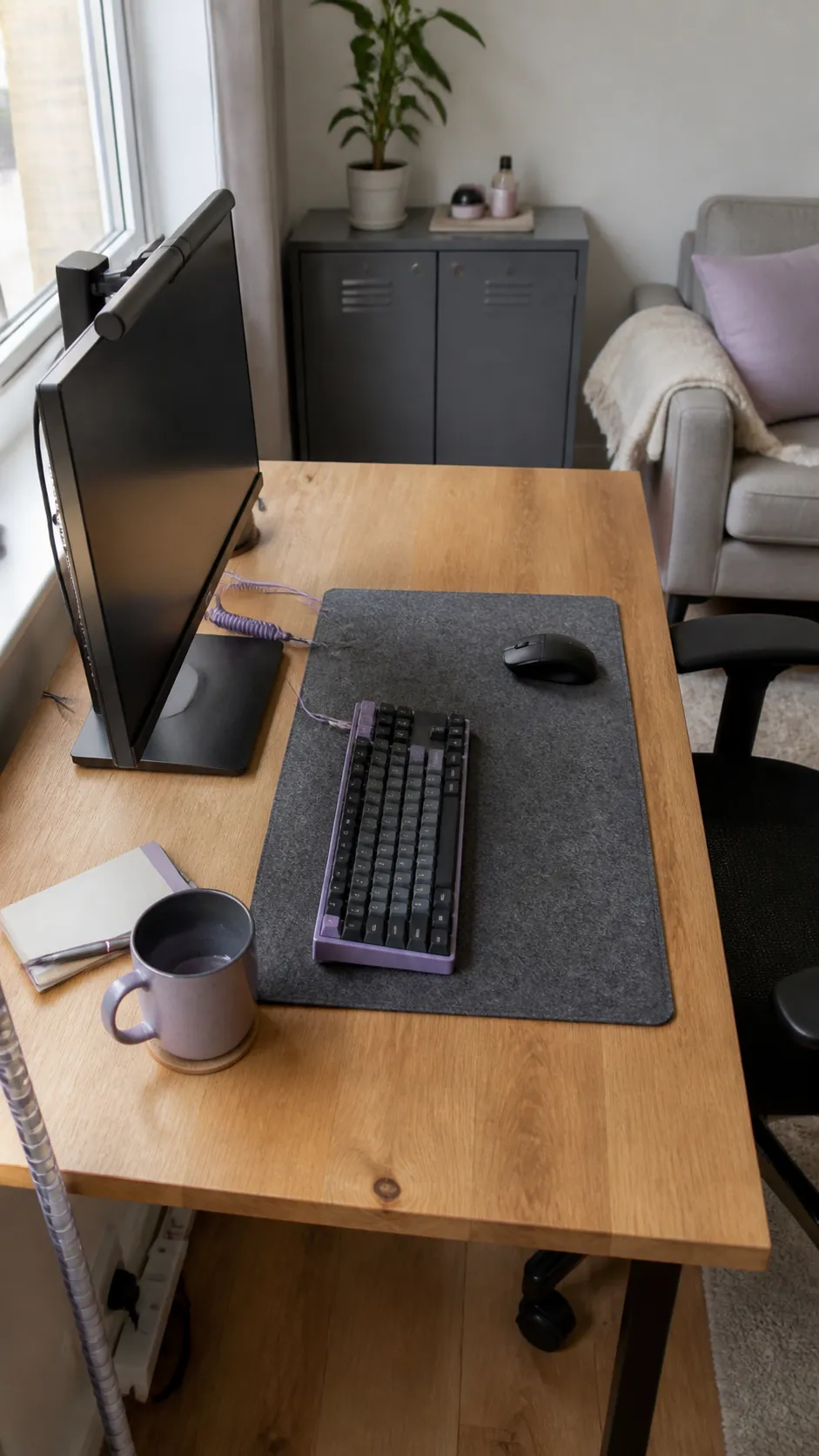 Compact keyboard leaving generous mouse space on a tiny desk