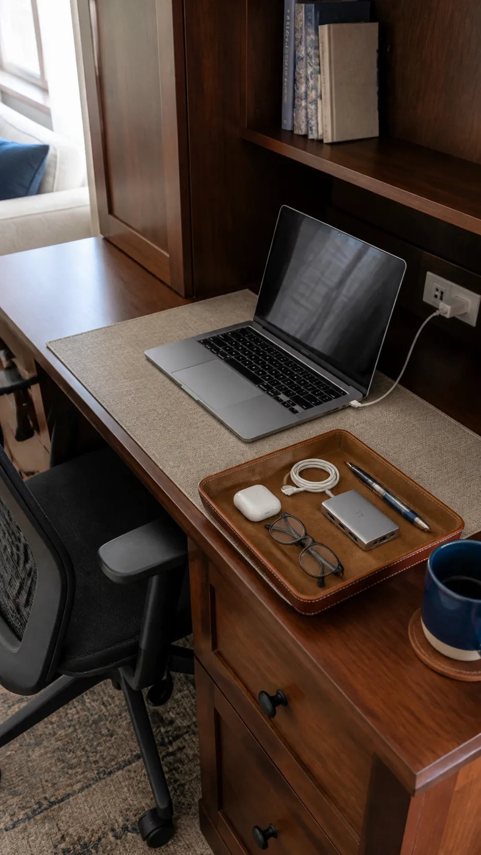 Small desk with one neat tray holding essential daily tools