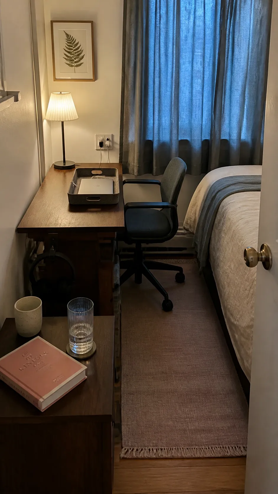 Slim bedroom desk doubling as a tidy bedside table
